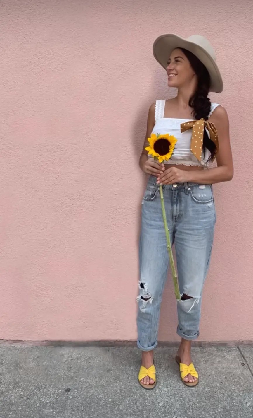 Haley Findlay holding a sunflower